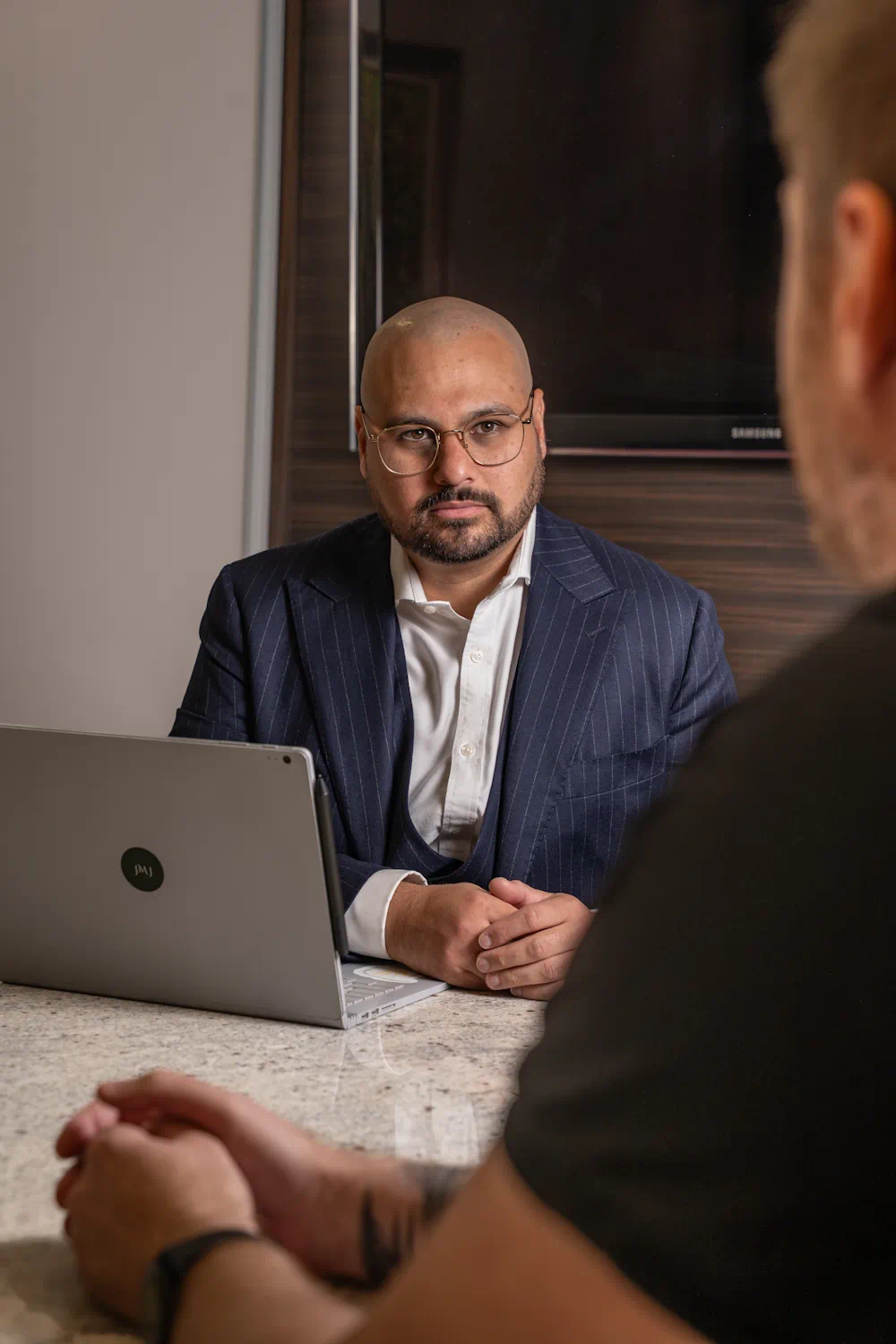 Professional man in suit at a meeting.